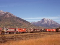 With less than a year left before CP shutdown most CLC/FMs, four of them, 8714 + 8724 + 8549 + 4104, are hustling a freight westward by the freight shed at Fernie, with Mount Hosmer in the background on the right and Three Sisters on the left.  The fourth unit, C-Liner 4104, is happily preserved today outside the former CP depot at Nelson.