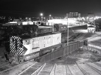 The E&N Baldwin roadswitcher era on Vancouver Island ended in 1975, with GP9s and the odd MLW S-4 (and one RS-23) then utilized, but in January 1978 and much to my surprise and disbelief (the shop foreman in Victoria was well known for his pranks and tall tales), I was advised Baldwin switcher 7070 was working at Wellcox yard in Nanaimo.  That was personally confirmed the next day on 1978-01-23, and Kodak did very well that day!

<p>Occasional maintenance trips to Victoria where I worked gave me many photo opportunities, with one of the best on graveyard shift on Monday 1979-04-09 when 7070 was posed half-on the turntable at night.  With a time exposure and me sitting very still in the cab and with a reliable friend to open then close the shutter ten minutes later, a shot simulating me running 7070 onto the turntable (note brakes applied and no exhaust) was achieved.  Having now reached 70 myself, this is the perfect day to share that shot of 7070.