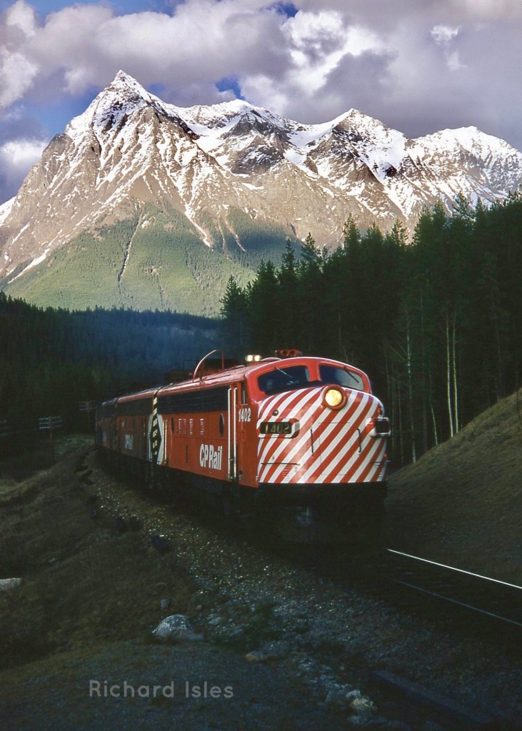 #1 Westbound “Canadian” passenger train to Vancouver British Columbia Canada, East of Leanchiol BC, with Chancellor Peak in the background. Mile 16.5