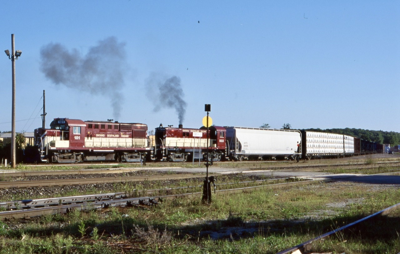 OSR is seen busy working Goodfellow lumber before collecting its train and heading for Guelph. Today the OSR is gone, as is the track in the foreground along with the switch behind.