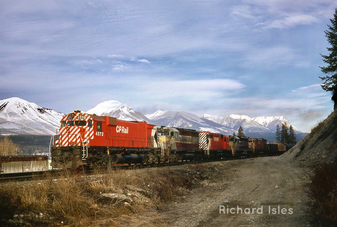 CP 4572+5504+5563+5520+4574 are at Golden,British Columbia ????????, This Eastbound freight is starting to follow the bend in the Kicking Horse River at Mile 34.7 entering the Mountain Sub on March 30, 1970.  Photographer: Richard Isles.