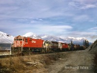 CP 4572+5504+5563+5520+4574 are at Golden,British Columbia ????????, This Eastbound freight is starting to follow the bend in the Kicking Horse River at Mile 34.7 entering the Mountain Sub on March 30, 1970.  Photographer: Richard Isles. 