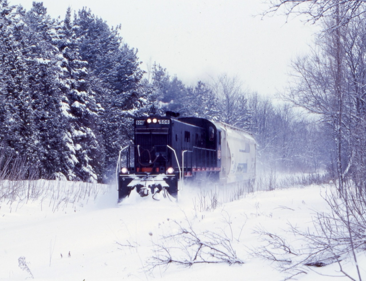 This size of train was somewhat common by this date thanks to a struggling economy. The RS23’s were common power during this time as they were more fuel efficient then the RS18’s. A decent snowfall over the weekend made for a nice Christmas card like scene as 506 headed for Guelph.