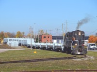 So........National Steel Car has been building coil cars for the NS.  They are brought down to St. Catharines where Steelcon is constructing the lids, or domes, rather, and they are being applied here at the plant just off Eastchester.
In this view 1859 has just brought more cars to be 'domed' and have pushed back to connect with the finished product inside the compound. Then 1859 brought the whole works out and backed the train across Eastchester on their main line and left the domed cars there, then pushing the new cars back into the compound where the next lot of domes will be applied and so the process repeats when the next lot from NSC comes in.
Finally, some entertainment on the North End. :o) I do not know how many cars NS has ordered.
I was surprised to see the 1859 working. Expected to see the red JLCX 3502, but I understand it has now gone off lease to GIO.