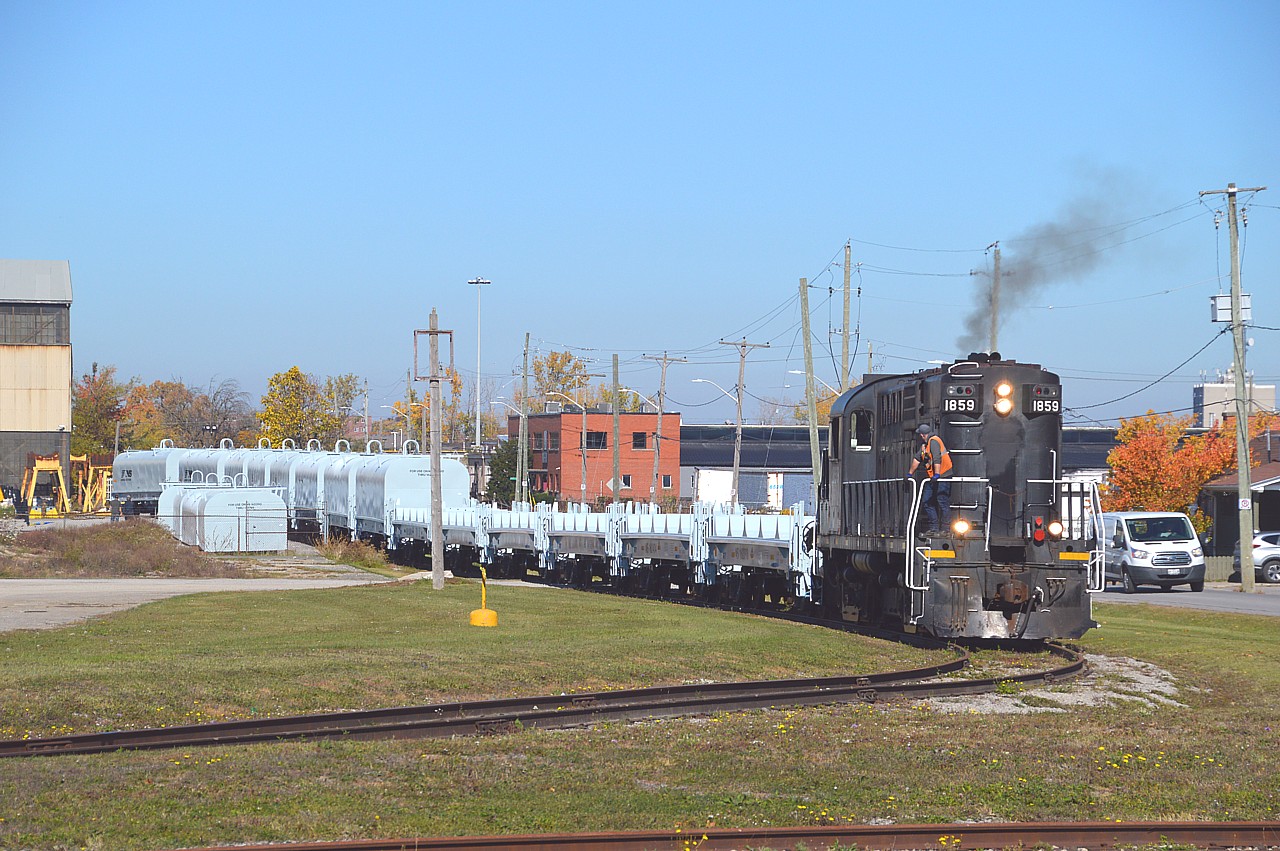 So........National Steel Car has been building coil cars for the NS.  They are brought down to St. Catharines where Steelcon is constructing the lids, or domes, rather, and they are being applied here at the plant just off Eastchester.
In this view 1859 has just brought more cars to be 'domed' and have pushed back to connect with the finished product inside the compound. Then 1859 brought the whole works out and backed the train across Eastchester on their main line and left the domed cars there, then pushing the new cars back into the compound where the next lot of domes will be applied and so the process repeats when the next lot from NSC comes in.
Finally, some entertainment on the North End. :o) I do not know how many cars NS has ordered.
I was surprised to see the 1859 working. Expected to see the red JLCX 3502, but I understand it has now gone off lease to GIO.