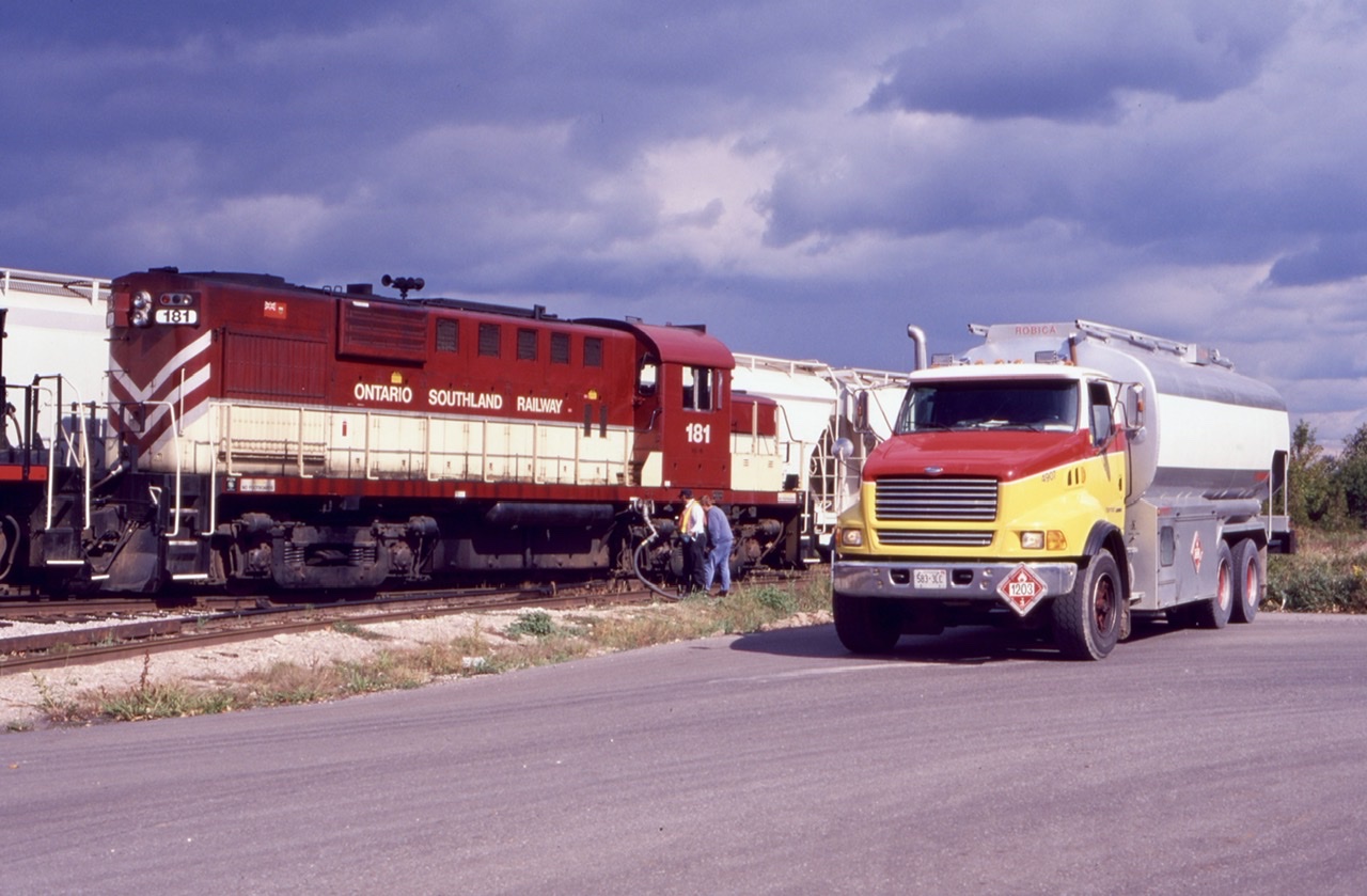 With unsettled skies above, the OSR takes a brief break to fuel its units at the Bi - Pro facility along the Guelph north spur. It’s just a part of the job when you work for a short line, to fuel the units wherever and whenever you can when time allows, without affecting the customers needs.