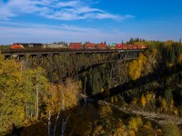 While we may not get the vibrant fall colours that Ontario enjoys, the Pembina River Valley always provides a nice backdrop in the fall.  Calgary to Vancouver train Q 14751 28 highballs through Entistle, as seen from the Yellowhead Highway