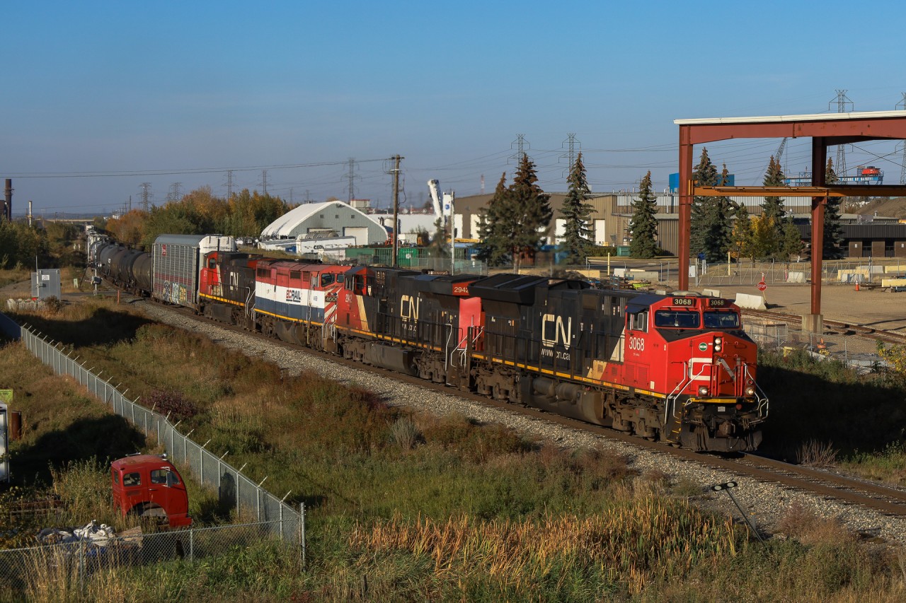 A 44251 01 departs Edmonton with CN 3068, CN 2942, BCOL 4609, CN 2576 and- 211 cars bound for Mirror and eventually Calgary.  Of note, BCOL 4609 is the third unit, which is the only Dash 8-40CM currently operating on CN.  And yes, that is a CN Pointe St. Charles Caboose up on a trestle in the distance!