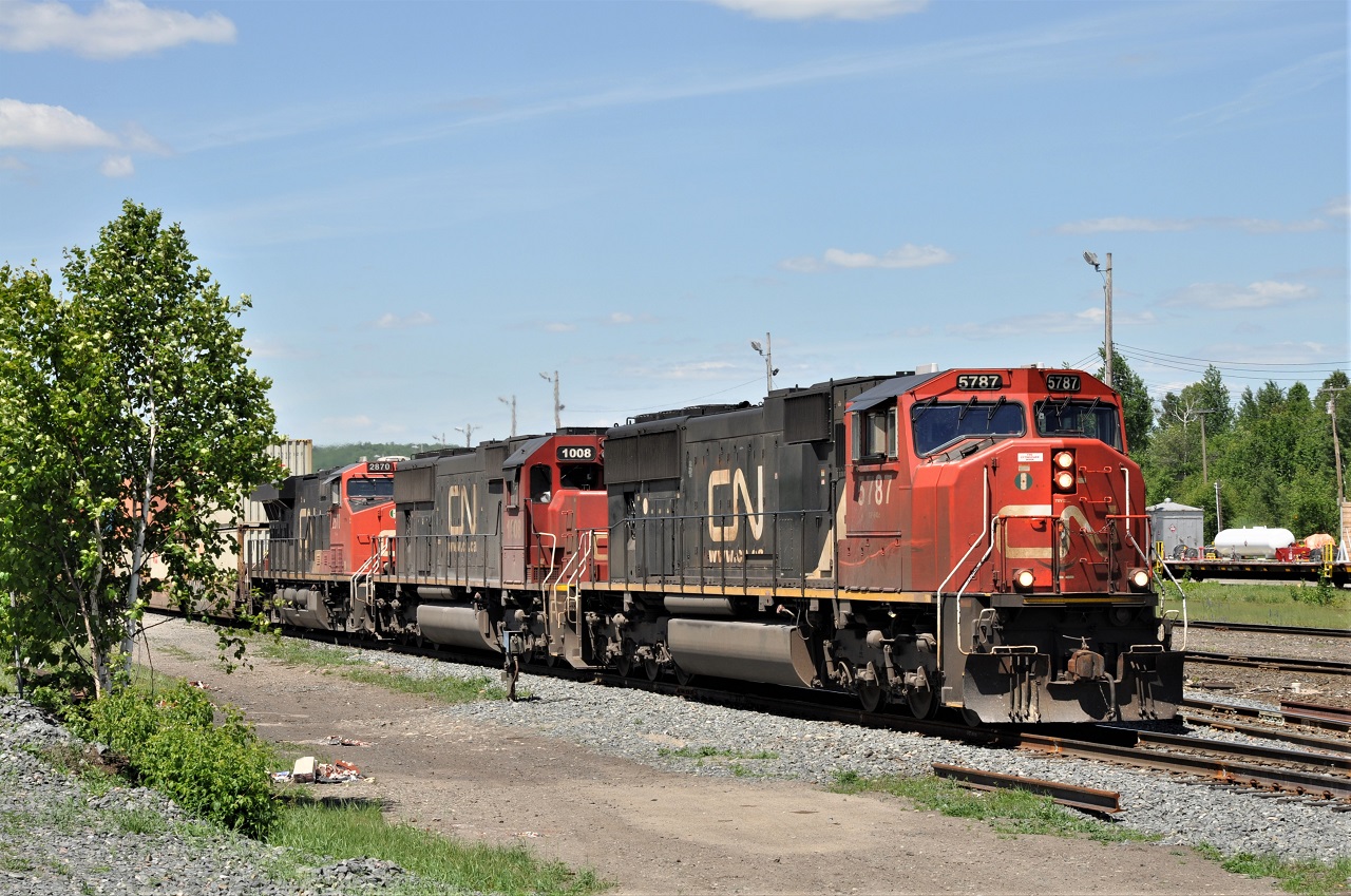 One of CN's many 100 series intermodal trains starts to pull out of Capreol, Ontario after a crew change.  Power for the train is CN 5787 IC 1008 and CN 2870.