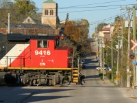 CN L568 with GP40-2L(W)’s 9416 and 9639 are seen approaching Madison Avenue on the Huron Park Spur in Kitchener as they head to the interchange with Canadian Pacific. 

