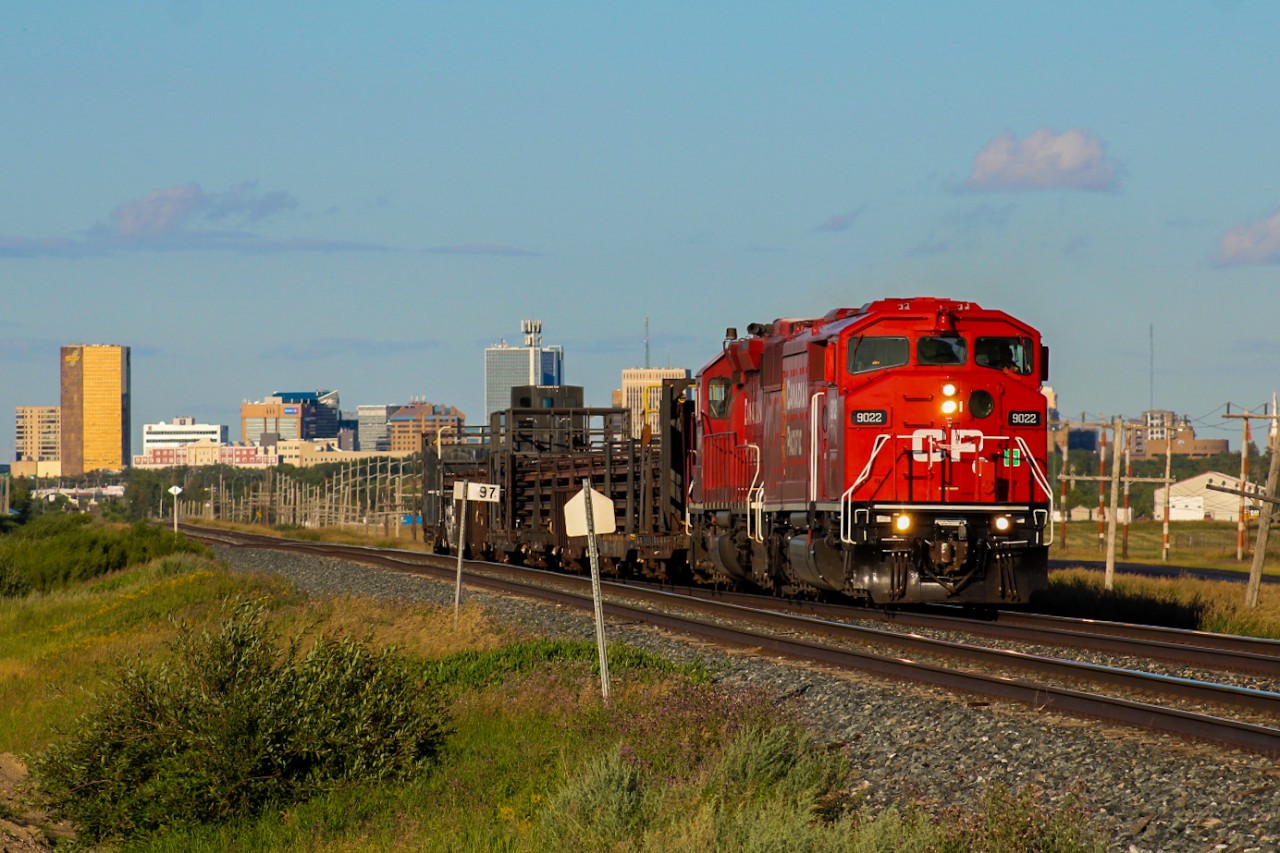 The various SD40-2Fs re-acquired by CP from the purchase of CMQ began their assimilating repaints into CP initials last April. The first of these units to be repainted, CP 9022, journeyed north from St. Paul into Winnipeg that May where it would spend the next 2 months running yard jobs and ballast runs to Dyment ON, only occasionally leading when running light power within yards. In July, this routine would change when it was placed on a CWR bound for the rockies with ex-SOO CP 6607 leading according to my sources. My head canon is that part of its CWR loads were dispersed along the way, likely leading to the power being wyed in Brandon MB as it spent a few days there. Once it departed on its way west again, CP 9022 would lead for the first time on the mainline under CP initials in almost a decade, exactly 3 months after it was released from the shops in St. Paul. The dry prairie atmosphere allowed for an evening of clear skies as it made its way through southern Saskatchewan. A strategically planned bike ride to the western edge of town yielded this capture of CWR-27 shortly after departing Regina with the skyline on full display.