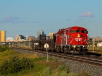 The various SD40-2Fs re-acquired by CP from the purchase of CMQ began their assimilating repaints into CP initials last April. The first of these units to be repainted, CP 9022, journeyed north from St. Paul into Winnipeg that May where it would spend the next 2 months running yard jobs and ballast runs to Dyment ON, only occasionally leading when running light power within yards. In July, this routine would change when it was placed on a CWR bound for the rockies with ex-SOO CP 6607 leading according to my sources. My head canon is that part of its CWR loads were dispersed along the way, likely leading to the power being wyed in Brandon MB as it spent a few days there. Once it departed on its way west again, CP 9022 would lead for the first time on the mainline under CP initials in almost a decade, exactly 3 months after it was released from the shops in St. Paul. The dry prairie atmosphere allowed for an evening of clear skies as it made its way through southern Saskatchewan. A strategically planned bike ride to the western edge of town yielded this capture of CWR-27 shortly after departing Regina with the skyline on full display.