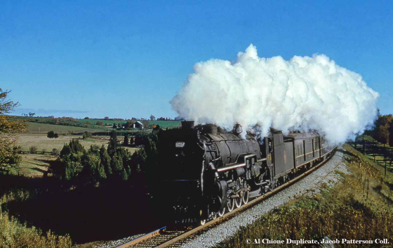 Daily except Sunday train 27 (Toronto - Stratford) starts into the curve on the approach to Guelph having just crossed Watson Road. U-1-a Mountain 6014, built by the Canadian Locomotive Company of Kingston in August 1923, would be scrapped in June 1961.Original Photographer Unknown, Al Chione Duplicate, Jacob Patterson Collection.