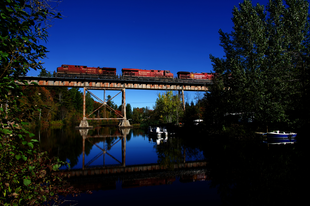 CP 223 has a trio of GEs as it crosses the Eastman trestle with a long train.
