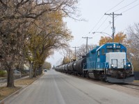 Southern Rails Cooperative Ltd shoves a string of empties down Home Street in Moose Jaw Saskatchewan toward the CP interchange. Fall is winding down and snow is in the forecast for the weekend. 