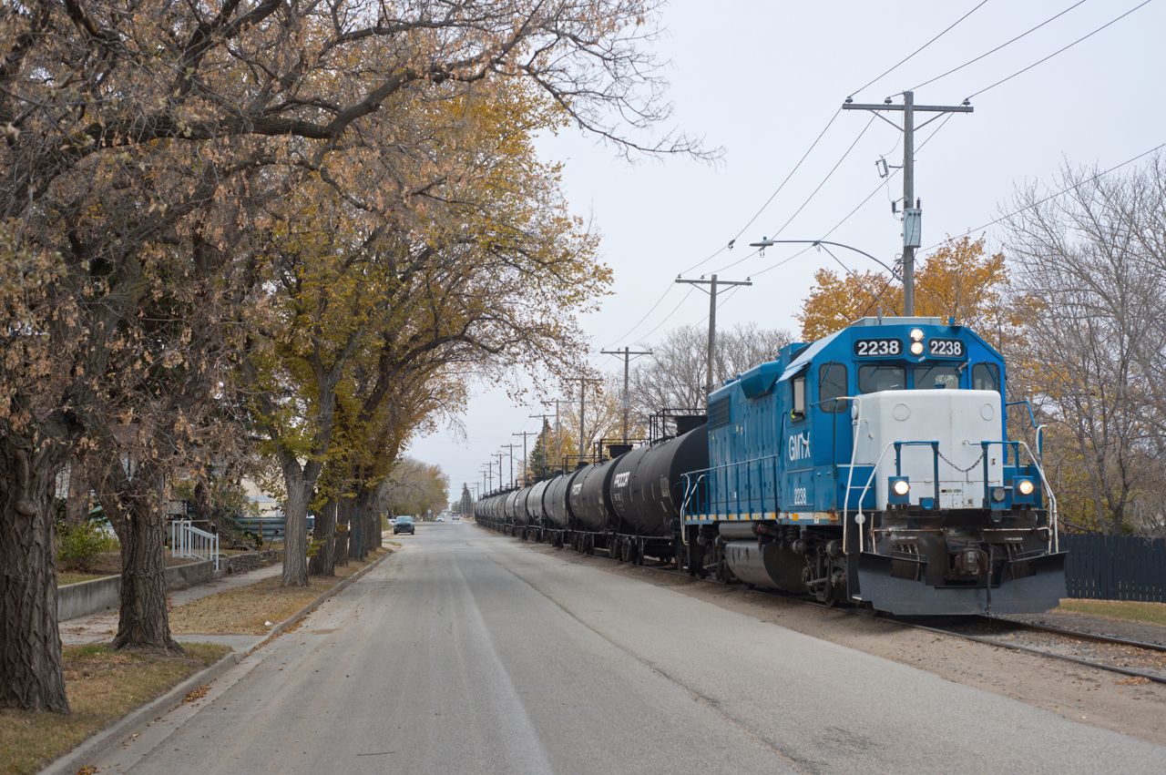 Southern Rails Cooperative Ltd shoves a string of empties down Home Street in Moose Jaw Saskatchewan toward the CP interchange. Fall is winding down and snow is in the forecast for the weekend.