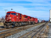 Photobombed! A pigeon cuts through the frame just above the headend power of Thunder Bay to Winnipeg freight 441. Having doubled up their tracks in E yard the crew are beginning the trek across the Kam Sub with a duo of EMD SD90Mac's 9151 and 9101.