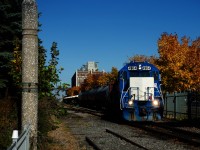 The Pointe St-Charles Switcher is starting to leave the Port of Montreal with a short cut of cars as it passes some fall colours. Power is CN 4904 & CN 7060.