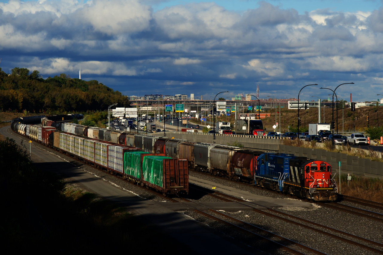 CN 596 is arriving at Turcot Ouest with cars for Toronto. It will back them up to the cars on Track 29 (at left) and then brake test the whole train. Later that evening road power will show up and take it to Toronto as CN X321.