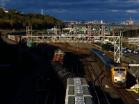 VIA 37 with VIA 920 and a Renaissance consist is passing Turcot Ouest. At left CN 596 is backing cars onto Track 29 as it finishes building a CN X321.