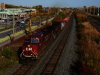 CP 8050 & CP 9712 lead a 100% intermodal CP 133 through Pointe-Claire, with some nice fall colours around. This train would not make it very far. At the next crew change spot (Smiths Falls) it would be broken up and yarded and it would only finally head west the next day, after being combined with the next edition of CP 133.