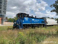 After picking up four loads in Streetsville, GMTX 333 is seen waiting for a green signal just south of the diamond at Brampton, where the OBRY crosses the CN Halton Subdivision. After crossing the diamond, the train would continue north to Snelgrove, where it would stop to set off the last car on the train - a tank car destined for Vulsay Industries, before continuing north to Orangeville with three loaded plastics hoppers destined for the railway's customers in town.