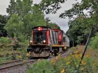 It wasn't the best of days when this shot was taken. Light rain, cloudy and overcast and the crew weren't to sure if the old GMD1, CN 1408 would have the power to pull this load up the grade after putting their train together at Edinburgh Road with the wet rails. They did make it as this photo shows as the approach Aberdeen Street. They would continue to worth the yard for several more hours. 