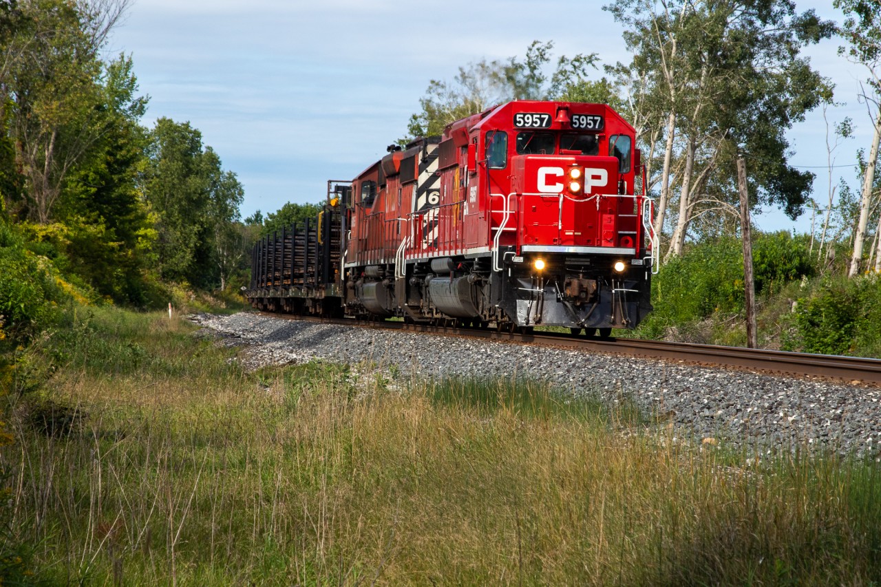CP SD40s have not exactly been plentiful in Southern Ontario in 2022. CP has been using GEs and manifest IDs to move and dump ballast, leaving CWRs as the only train to consistently get pulled by SD40s. So when CP 5957 & CP 6055 are bringing a SB Continously Welded Rail train down the Mactier, some friends and I drove up to chase it all the way down. Here, CP 5957S is crawling up to NSS Craighurst where they will take the siding for 113.