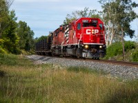 CP SD40s have not exactly been plentiful in Southern Ontario in 2022. CP has been using GEs and manifest IDs to move and dump ballast, leaving CWRs as the only train to consistently get pulled by SD40s. So when CP 5957 & CP 6055 are bringing a SB Continously Welded Rail train down the Mactier, some friends and I drove up to chase it all the way down. Here, CP 5957S is crawling up to NSS Craighurst where they will take the siding for 113. 
