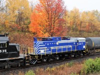 Hitching a ride on CN 422, the Iron Ore Company of Canada's BMEX 520, is making the return trip from Brookville Equipment in Falls Creek Junction Pennsylvania after its repairs had been completed. The electric train was one of only 9 ever built. The fall colors and the nice clean paint make for a nice contrast to the dull skies overhead.