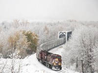 First snow of the season today. Enjoy your fall while you can! CP 8633 leading a grain train across one of the twin trestles in the community of Bowness Calgary. 