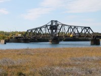Spanning the North Channel between Goat Island and Manitoulin Island, the former Canadian Pacific Railway Swing Bridge was located at Mile 38.27 Little Current Subdivision. The bridge was opened to rail traffic in October 1913 providing a rail link to Little Current, the western terminus of the Algoma Eastern Railway. In November 1945 modifications to add a vehicular deck for road traffic were completed providing a road link to Manitoulin Island. The bridge was shared by rail and road traffic until the abandonment of the rail line into Little Current. Now known as the Little Current Swing Bridge, it carries a single lane of road traffic and a pedestrian sidewalk. The bridge is a designated Ontario Heritage Property. A new bridge is planned to be built to the west of the existing bridge.

