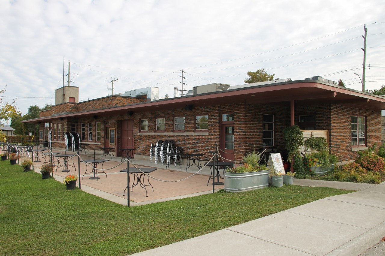 The track side view of the former Canadian Pacific Railway Owen Sound station. Situated on the east side of Owen Sound Harbour, the area is void of railway activity or remnants of what was once a railroad. Located at Mile 73.0 on the Owen Sound Subdivision, the station was built in 1946-47. Today the station is home to Mudtown Station Brewery and Restaurant, although there would be no stopping here today to enjoy the patio.