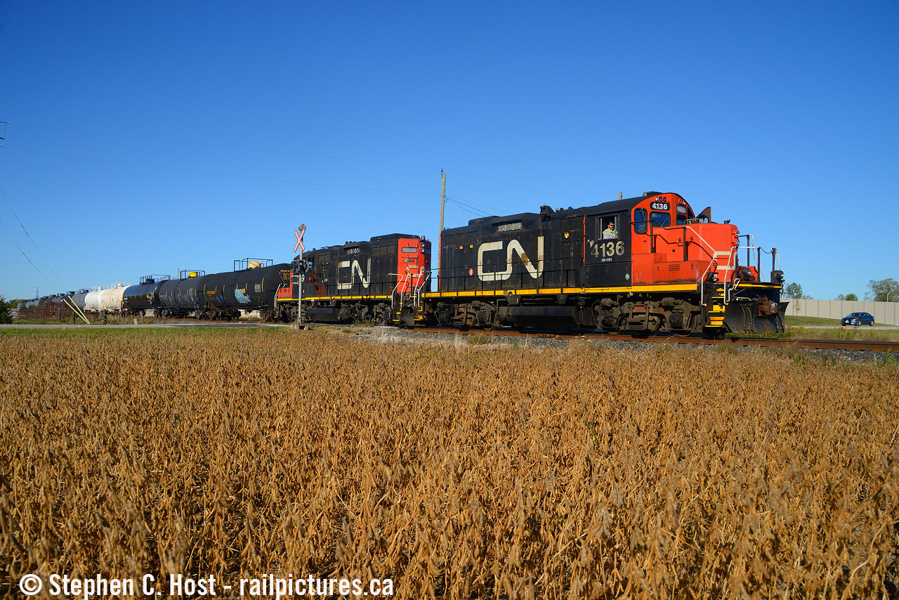 A pair of GP9RM's heading south in Sarnia with traffic for a local industry during the fall harvest.