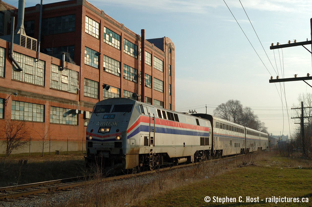 VIA 85 blasts out of Kitchener with Amtrak 29 in the lead passing the Airboss factory which had rail service until CN took over. I only had two to three weeks to photograph this train with my good camera after getting it in March 2004 and I pretty much photographed it every work day as I followed the train into town.

Airboss no longer has rail service, but back in the day they got both CN and CP service (Grand River Railway, would have also been electric!) as the CP/GRR underpass with CNR was at the west end of the factory.