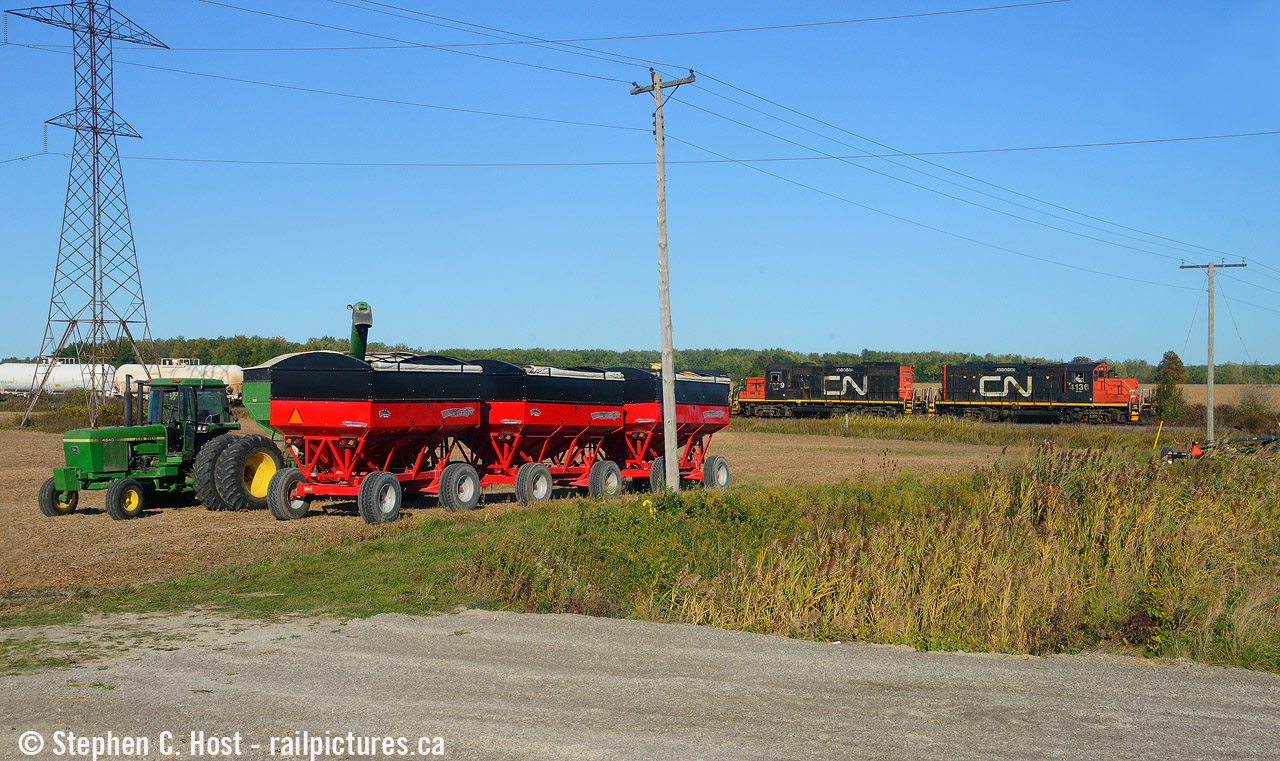 Usually my trips to Sarnia end up with some kind of industrial scene, but I followed the Terra job pretty far south and ended up near Sombra Ontario where I found a farmer preparing for harvest. Leading the train is the unique (so far) CN 4316 without its 'zebra' stripes after getting a replacement hood in Winnipeg earlier in the year. The Terra job works in the mid afternoon heading all the way to the end of the St. Clair spur to work CF Industries (formerly Terra) fertilizer plant, amongst many others on the way down and back. There's literally about 20 customers on the St. Clair spur.