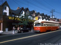 TTC PCC 4384 operates on an eastbound Carlton run, diverting southbound over Parliament Street between Carlton and Gerrard. The streetcar is passing a row of Victorian-era houses home to Wayne Furniture, at the time celebrating its 45th birthday.
<br><br>
From some <a href=https://thecjn.ca/perspectives/from-the-archives-family-business/><b>research online</b></a>, it appears Wayne Furniture stated off selling Radios as the Wayne Radio Company at 446 Parliament Street in 1944. It was opened by Max Wainberg and his sons, and operated through three generations of the family. Other information on the business is hard to find, but it appears they may have closed down sometime in the 90's or early 2000's.
<br><br>
<i>Original photographer unknown, Dan Dell'Unto collection slide.</i>