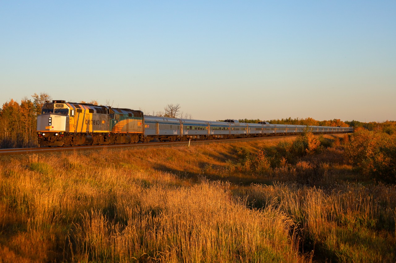 The Canadian blasts through Uncas on the Wainwright Sub, during the last few minutes of daylight.  With the days getting shorter, it'll be tough to shoot the Canadian on its approach to Edmonton.  P 00131 25: VIA 6445, VIA 6431 and 21 cars