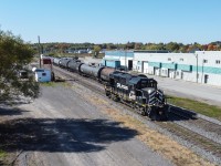 CFL RS-18-3a has returned from the Quebec Gatineau interchange in Joliette and is running around its train before shoving up to the yard.