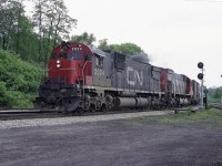 Still cannot believe how many years it has been since us fans of MLW behemoths enjoyed catching these units rather frequently while gathered at Bayview BSing and watching trains. I do forget who was around on this particular day in mid 1978 but since it was a Sunday I am sure there was a good crowd.
CN 2024 and 2313 are seen working westward in this rather late day image, with a rather long train. I recorded the caboose as CN 79431.