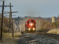 A brief opening in the clouds was appreciated as a local notches up the hill as it returns from servicing Guelph Junction. Nothing says old school railroading like geeps running at mainline speeds.