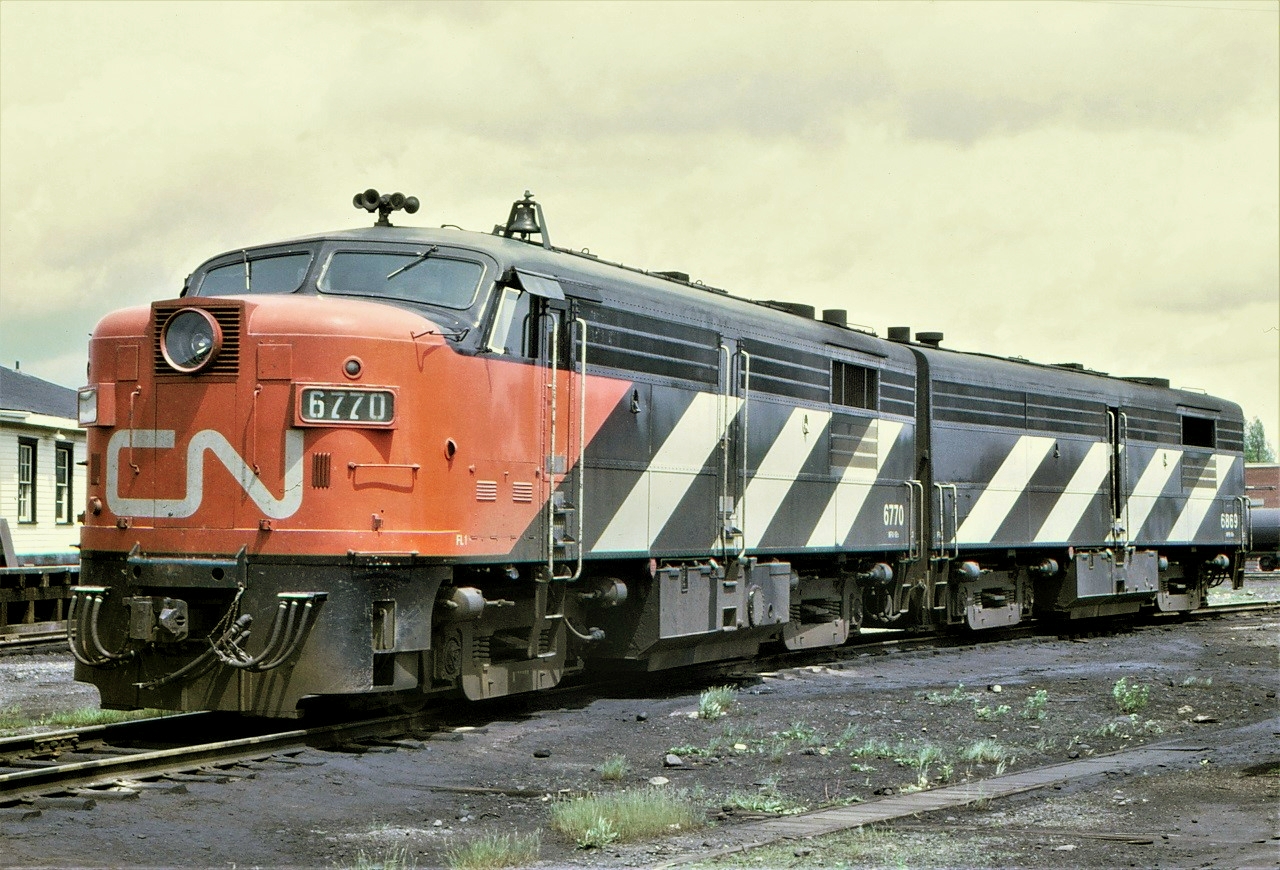 A matched pair of CN passenger units, FPA4 6770 and FPB4 6869, rest on one of the shop tracks at Capreol, Ontario on June 17, 1969 after bringing the Toronto section of the Panorama into town.  The units will be turned and head back to Toronto that night on the Panorama.