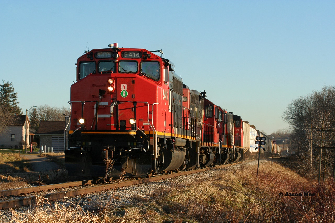 A rare early morning westbound CN L540 is viewed at the west siding switch Baden heading to Stratford on the Guelph Subdivision with 9416, 7080, 4136 and 4796.