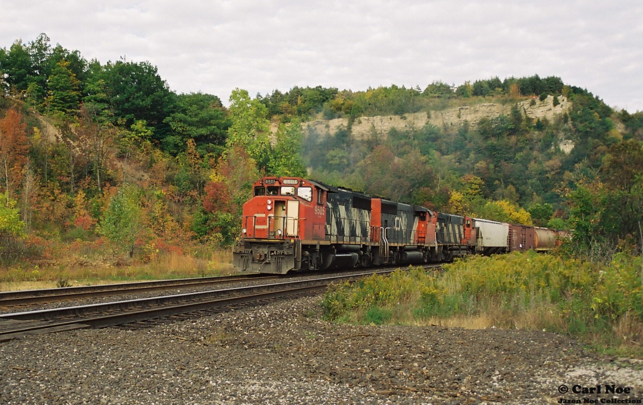 CN 9505 west climbs up the grade through Dundas, Ontario on the namesake Dundas Subdivision during an early fall day with a consist that included a fellow GP40-2L(W) and an M-420(W).
