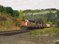 CN 9505 west climbs up the grade through Dundas, Ontario on the namesake Dundas Subdivision during an early fall day with a consist that included a fellow GP40-2L(W) and an M-420(W).