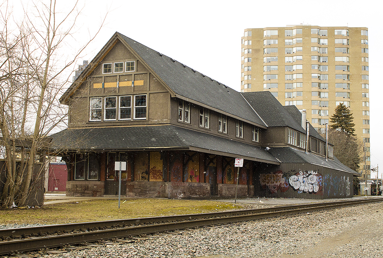 APRIL FOOLS! Sadly, no jokes can be made about this old lady as it sits downtown neglected. Although a brief squall developed, I wasn't planning for a full shot of the old CP station at all. It was a set of headlights in the distance that had initially caught my eye, and I had planned to hopefully shoot both passing train and work the station in. Although the train didn't come, I figured judging by the sad state that the station is in, I had better get my photos now before it's gone. The clouds, and brief snow all but adds to the mood that is the demise of once glorious architectural gems.