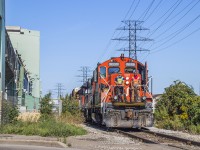Deep in Hamilton's Industrial north end, CN's 0700 job proceeds east down the N&NW Spur.  Today's work will include switching out <a href=http://www.railpictures.ca/?attachment_id=46743>Parkdale Warehousing</a> and a set off on the Irondale Lead for <a href=http://www.railpictures.ca/?attachment_id=46525>Railcare.</a>