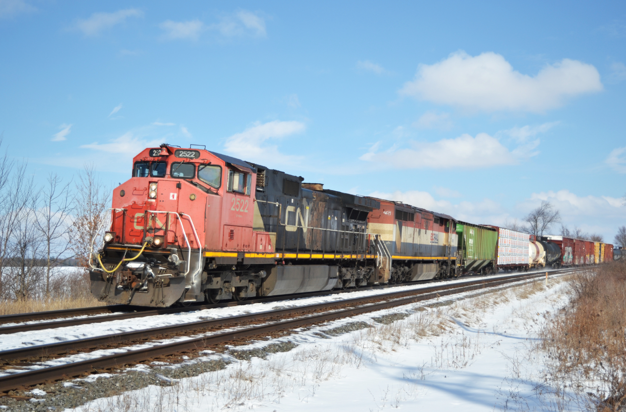 What I believe is CN 383 rips by Powerline Road with a rather Canadian lashup in tow. It is a shame, with only one BCOL C40-8 left operating, I regret taking this for granted, given how fast things were retired. At least the C44's are holding their own, for now.