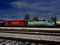 CP G95 has CMQ 3817 & CP 3035 for power as it switches out Dural, one of a handful of clients still served by CP in the Montreal area. In the foreground is CN's Montreal Sub, triple tracked here.
