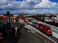 Calling themselves 'Extra Roadswitcher' on the scanner, CP 3035 & CMQ 3817 are leaving Lachine IMS for St-Luc Yard with some intermodal traffic after doing a bit of switching here.
